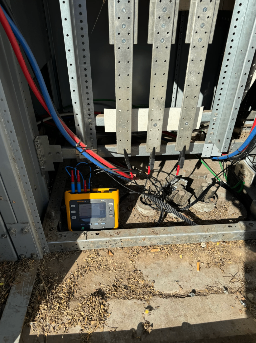 Testing equipment connected at the base of commercial switchgear