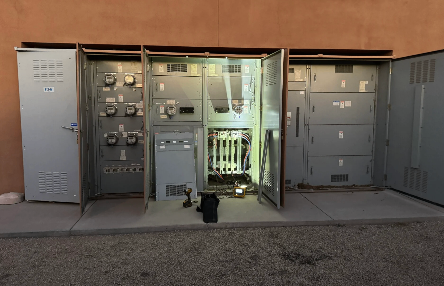 Open multi-meter commercial electrical equipment during a service upgrade project