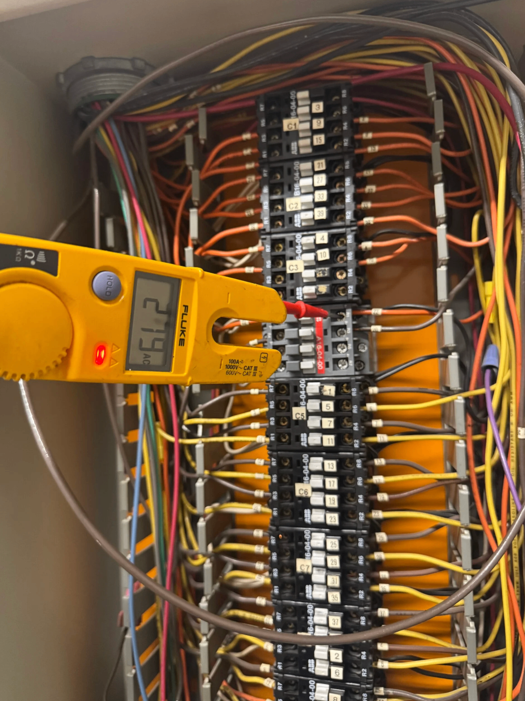 Metering and breaker assembly being tested with electrical diagnostic equipment